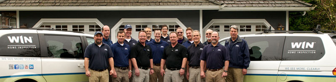 Group of home inspectors with WIN vans