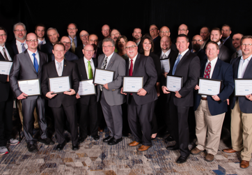 Group of WIN business owners with awards