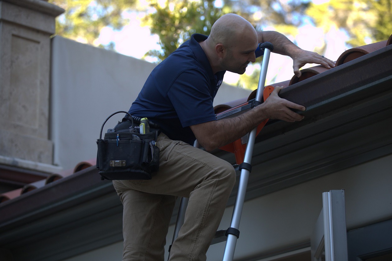 home inspector checking the house roof