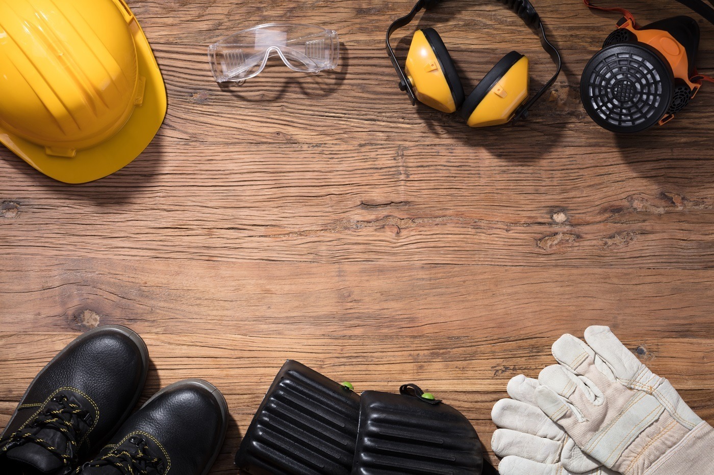 Safety Equipment On Wooden Background