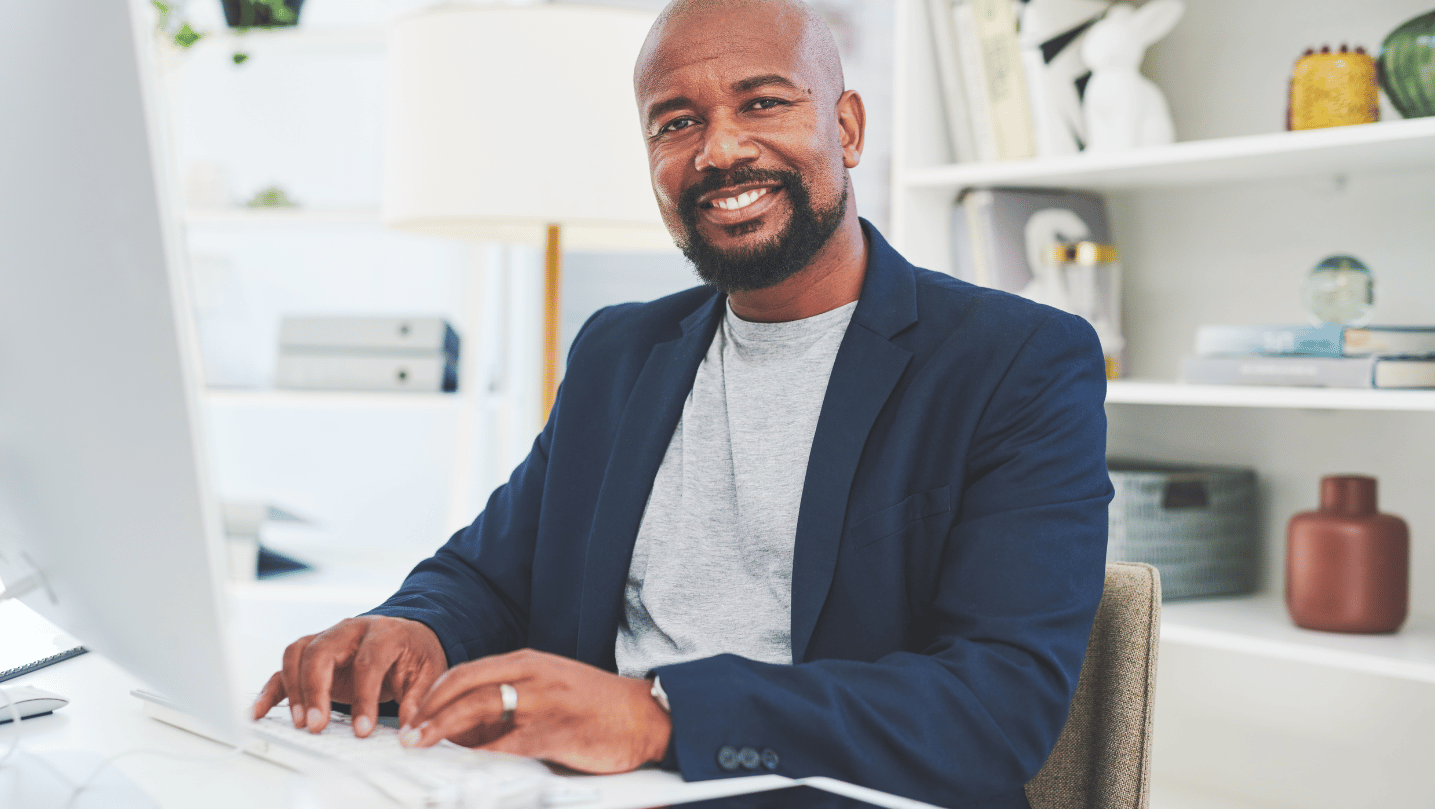 Portrait of a mature businessman working on a computer in an office