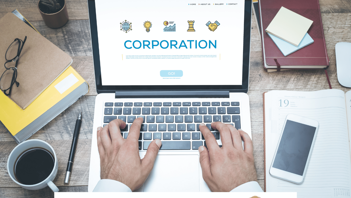 'CORPORATION' written on a laptop screen